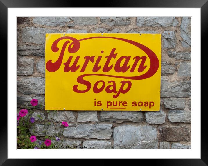Enamel sign advertising Puritan soap on a wall in Buckfastleigh, Devon. Framed Mounted Print by Peter Bolton