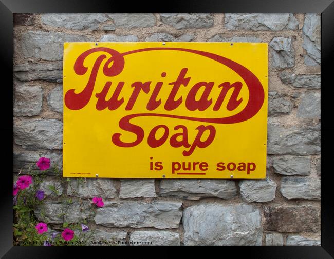 Enamel sign advertising Puritan soap on a wall in Buckfastleigh, Devon. Framed Print by Peter Bolton