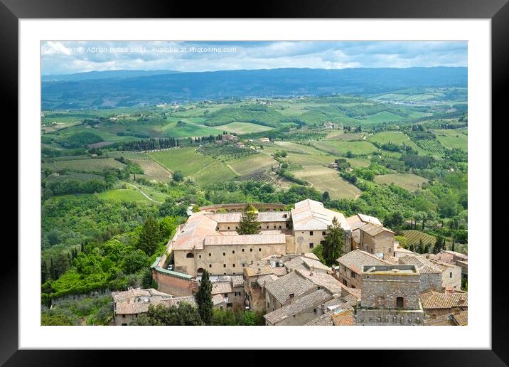 A view of Tuscany from a medieval tower in San Gimignano Framed Mounted Print by Adrian Beese