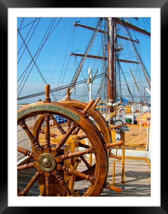 The ships wheel and view across the deck of tall ship Khersones. Southend on sea visit. Framed Mounted Print by Peter Bolton