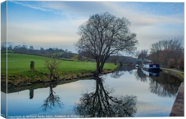 Spring is springing on the canal at Rodley Canvas Print by Richard Perks