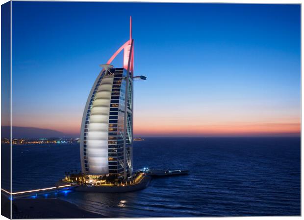 Sunset at the Burj Al Arab Canvas Print by Tommy Dickson