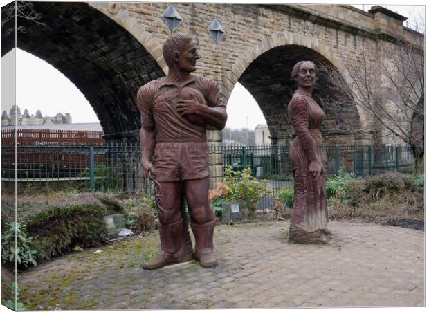 Sculptures of man and woman in Dewsbury Canvas Print by Roy Hinchliffe