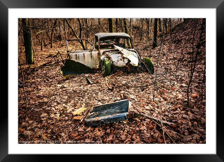 Car wreck desolated worn and rusty left in a forest, Denmark Framed Mounted Print by Frank Bach