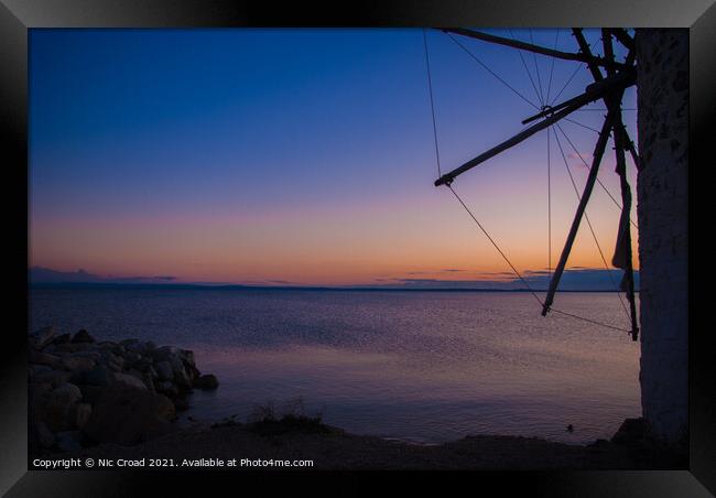 Greek Windmill at Sunset Framed Print by Nic Croad