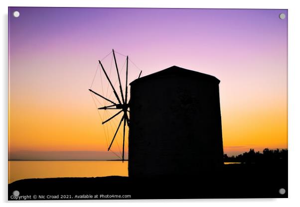 Silhouette of a Greek windmill at sunset Acrylic by Nic Croad
