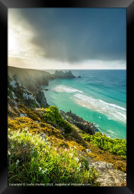 Spring showers over Porthcurno, Cornwall Framed Print by Justin Foulkes