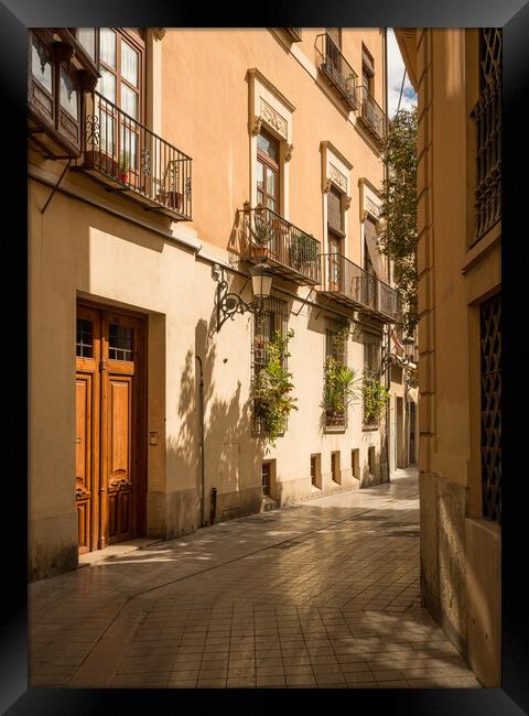 Narrow peaceful street in old town of Valencia Spain Framed Print by Steve Heap