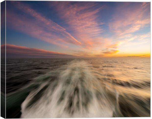Sunset behind a cruising cruise ship at sea Canvas Print by Steve Heap