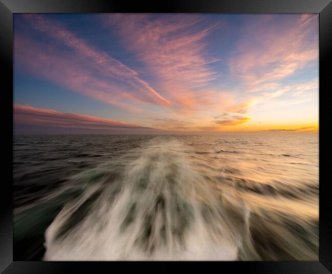 Sunset behind a cruising cruise ship at sea Framed Print by Steve Heap