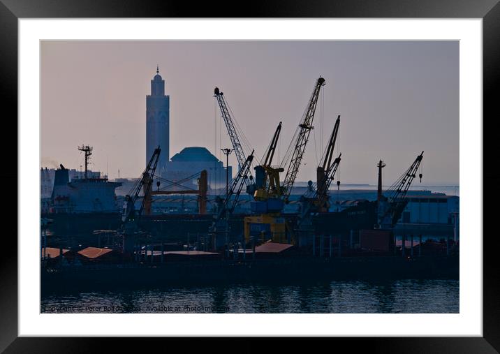 Docks at Casablanca harbour with the Grand Mosque in the background. Framed Mounted Print by Peter Bolton