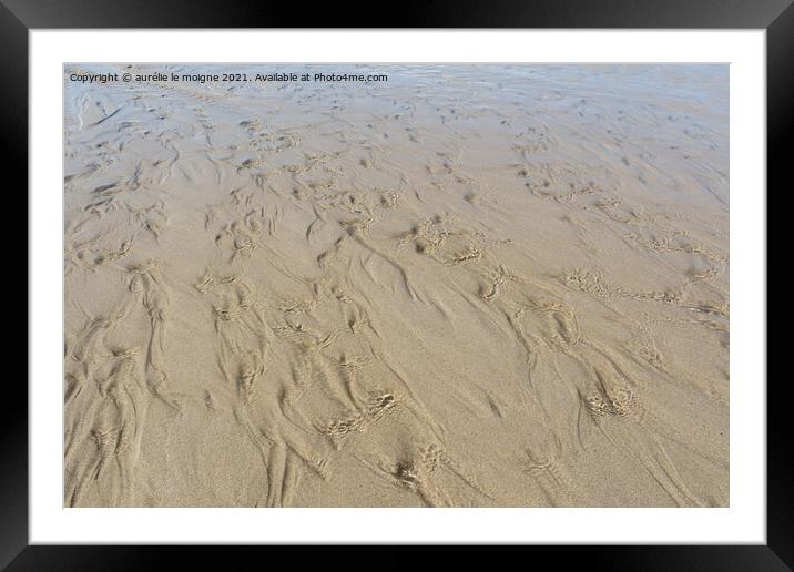Water flowing on the sand Framed Mounted Print by aurélie le moigne