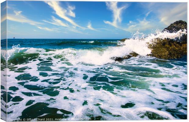 Waves crashing over the rocks with surf and spray Canvas Print by Travel and Pixels 