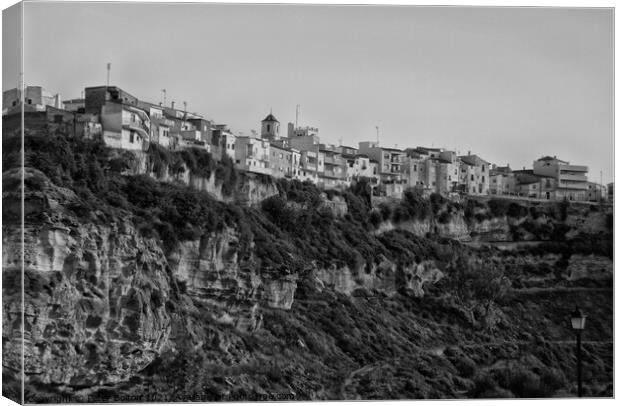 One of the Pueblos Blancos (white villages) near Malaga, Spain. Black and white. Canvas Print by Peter Bolton