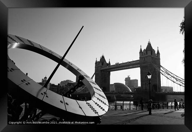 London bridge and sundial in monochrome Framed Print by Ann Biddlecombe