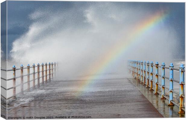 Rainbow in the Waves Canvas Print by Keith Douglas