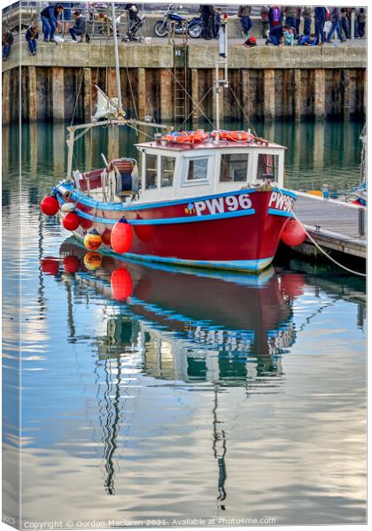 A fishing boat moored in Padstow Harbour  Canvas Print by Gordon Maclaren