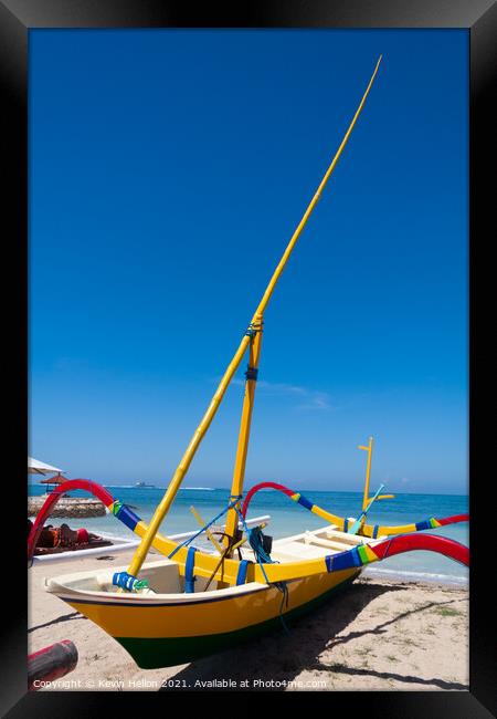 Traditional jukung boat on the beach in Sanur, Bali, Indonesia Framed Print by Kevin Hellon