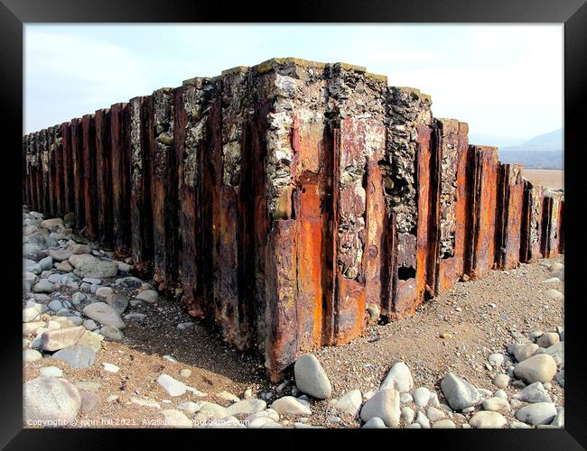  Iron Sea Defences in Wales. Framed Print by john hill
