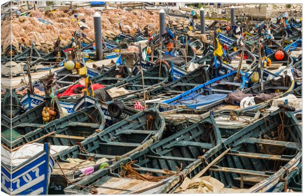Wooden fishing boats lined up in Agadir harbour Canvas Print by Jason Wells