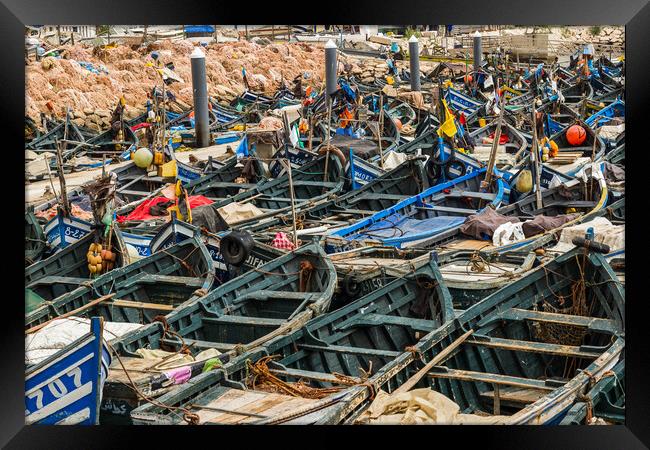 Wooden fishing boats lined up in Agadir harbour Framed Print by Jason Wells