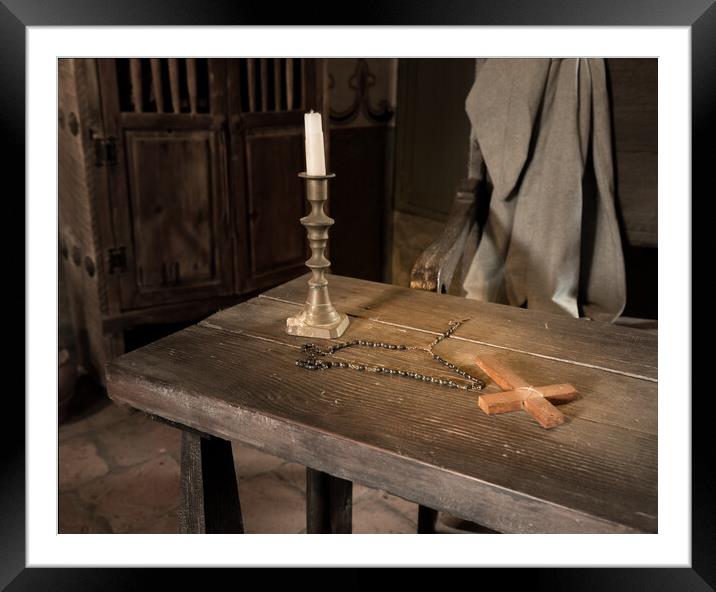 Ancient table with candle, rosary and cross in priest room Framed Mounted Print by Steve Heap