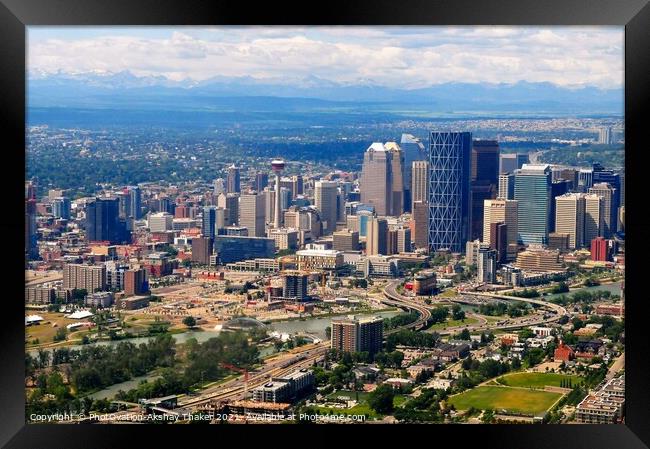 Aerial view of city of Calgary with Rocky Mountains in the background. Framed Print by PhotOvation-Akshay Thaker