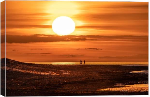 A sunset stroll on Holme beach  Canvas Print by Gary Pearson