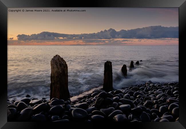 Groynes on Westward Ho! beach Framed Print by James Moore