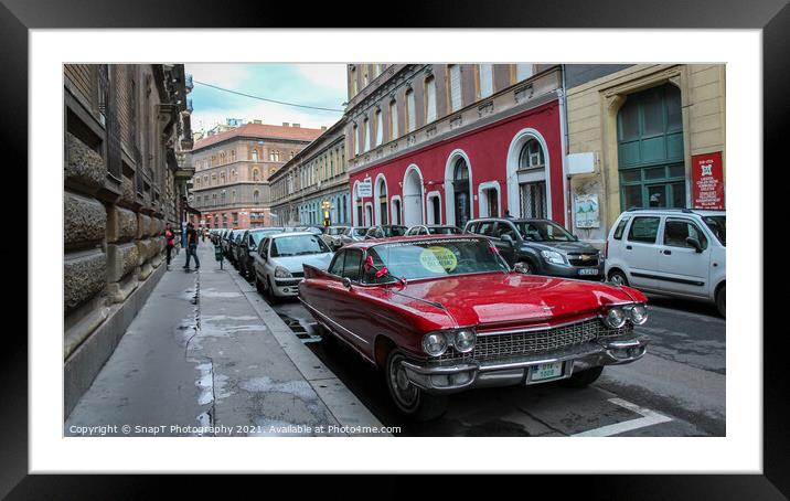 Vintage red cadillac deville car parked in a Budapest street in the evening Framed Mounted Print by SnapT Photography