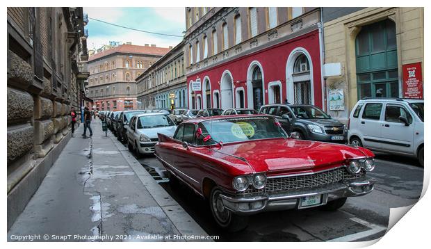 Vintage red cadillac deville car parked in a Budapest street in the evening Print by SnapT Photography