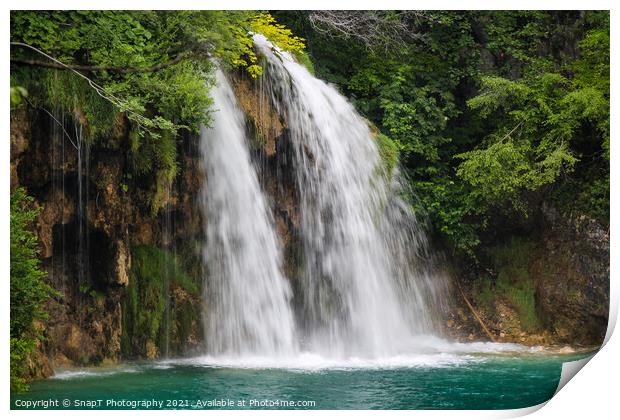 A waterfall flowing into a lake at Plitvice Lakes, Unesco world heritage site Print by SnapT Photography