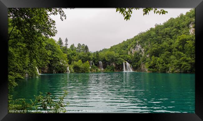 Water flowing over a series of waterfalls into a lake at Plitvice Lakes, Croatia Framed Print by SnapT Photography