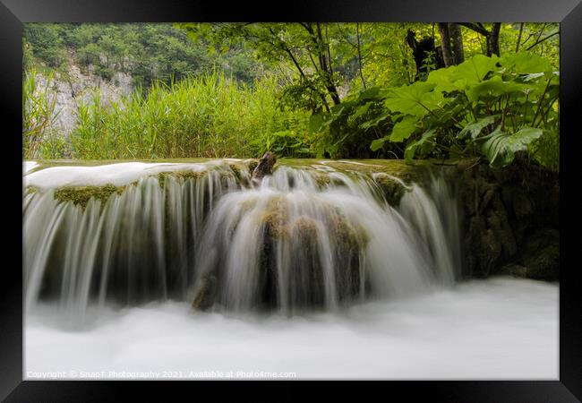 Long exposure of water flowing over a small waterfall at Plivice Lakes, Croatia Framed Print by SnapT Photography