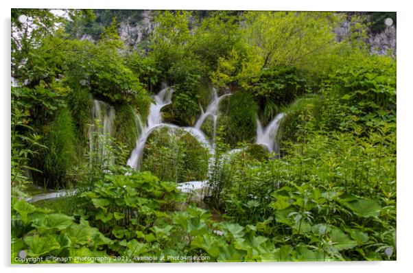 Water flowing through vegetation and over a waterfall at Plitvice Lakes Acrylic by SnapT Photography
