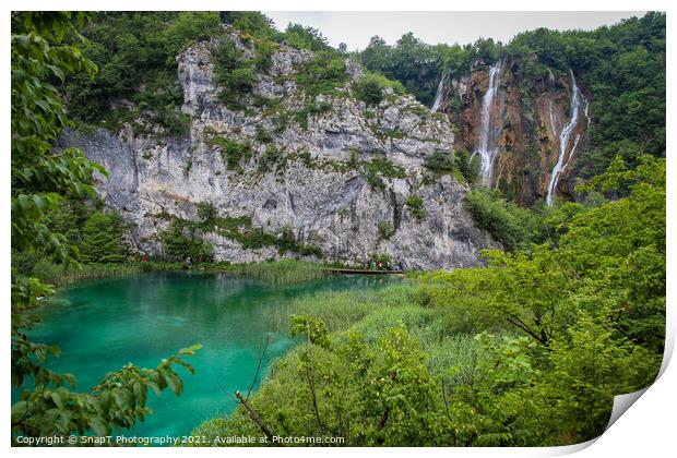 A large waterfall flowing over a mountain into a lake at Plitvice Lakes, Croatia Print by SnapT Photography