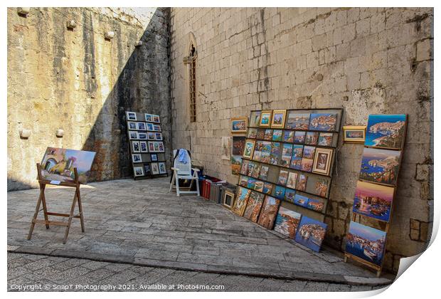 An artists stall in Dubrovnik's old town in a late summers afternoon, Croatia Print by SnapT Photography