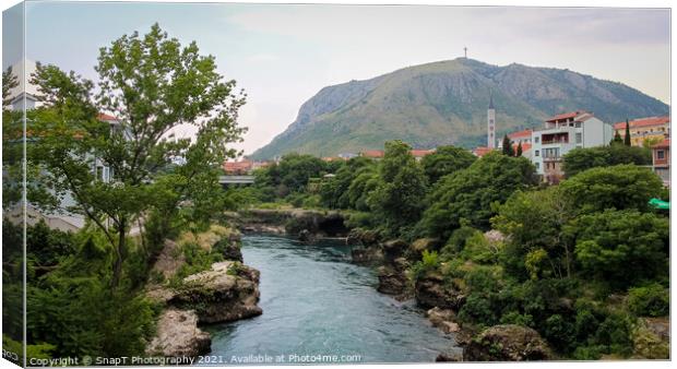 The Neretva River flowing through Mostar, with Hum Hill and Christain Cross Canvas Print by SnapT Photography