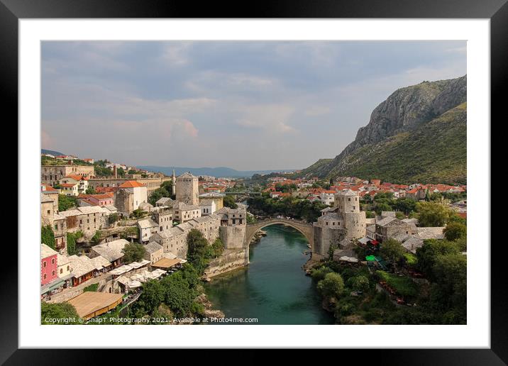 A landscape view of the old town of Mostar, with the old bridge over the river Framed Mounted Print by SnapT Photography