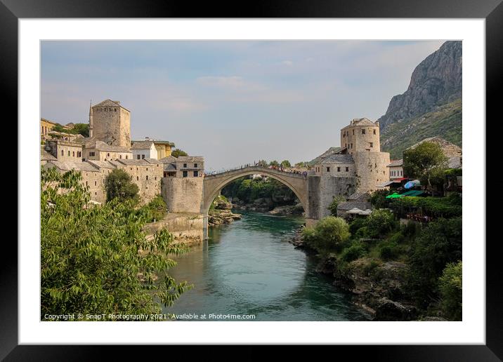 A landscape view of the old town of Mostar, with the old bridge over the river Framed Mounted Print by SnapT Photography