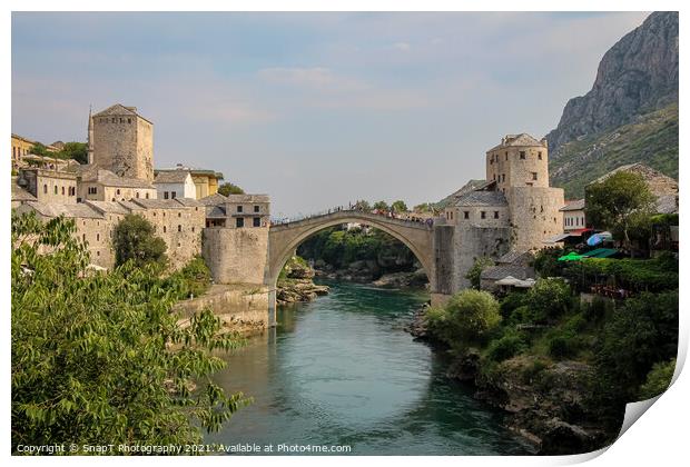 A landscape view of the old town of Mostar, with the old bridge over the river Print by SnapT Photography