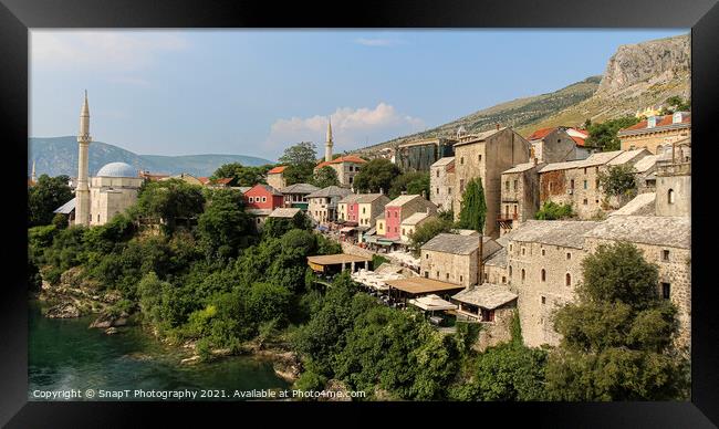 The old town of Mostar looking upstream from the historic old arched bridge Framed Print by SnapT Photography