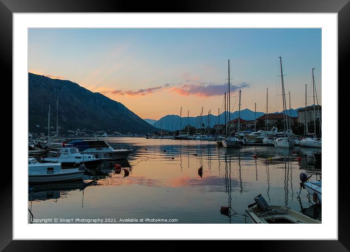Boats moored in Kotor harbour at sunset, by the old town, Montenegro Framed Mounted Print by SnapT Photography
