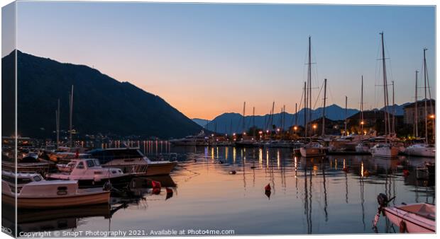 Sunset reflecting over the harbour of the Old Town of Kotor, Montenegro Canvas Print by SnapT Photography