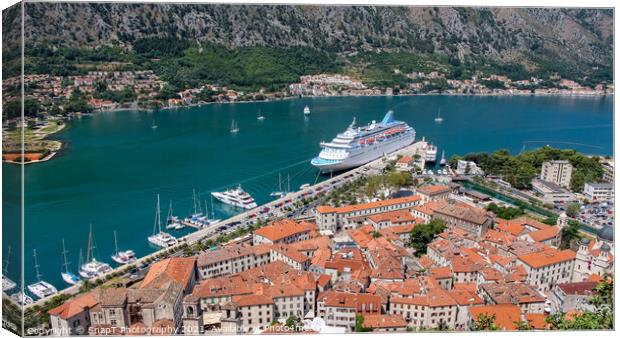 A cruise ship moored at the UNESCO World Heritage Site of the Old Town of Kotor Canvas Print by SnapT Photography