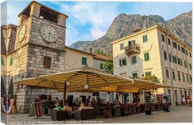 A cafe at the Clock Tower at the Square of Arms, the Old Town of Kotor Canvas Print by SnapT Photography