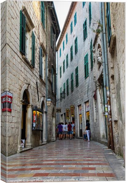 A narrow street in the Old Town of Kotor, with Medieval architecture Canvas Print by SnapT Photography
