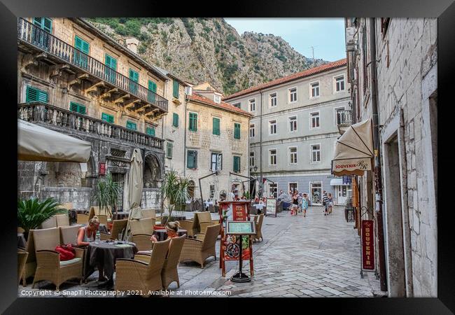 A cafe in a square at sunset, in the Old town of Kotor, Montenegro Framed Print by SnapT Photography