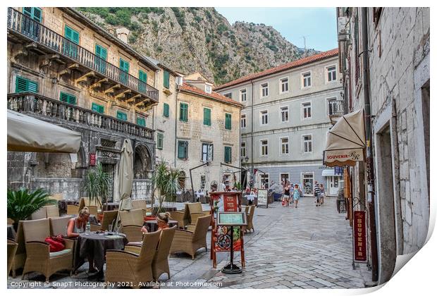 A cafe in a square at sunset, in the Old town of Kotor, Montenegro Print by SnapT Photography