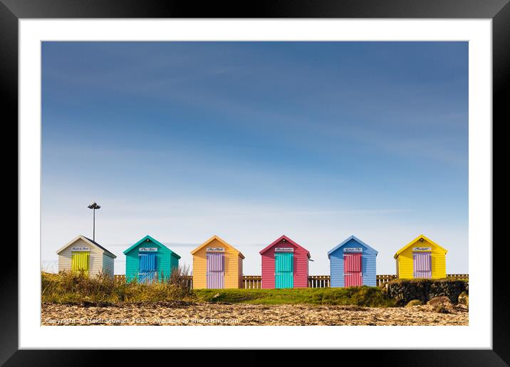 Colourful Beach Huts at Amble Framed Mounted Print by Heidi Stewart